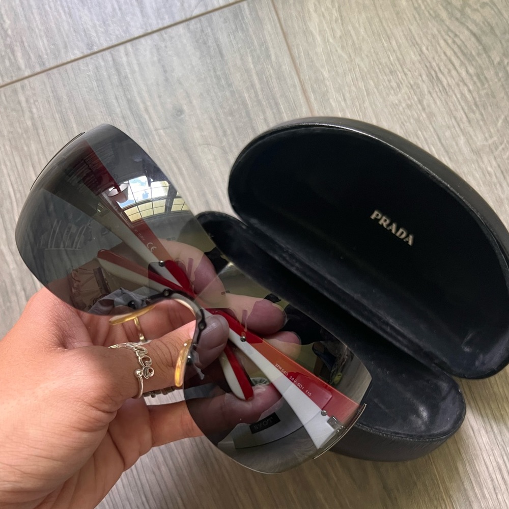 Authentic Prada sunglasses. Excellent condition. Unisex.